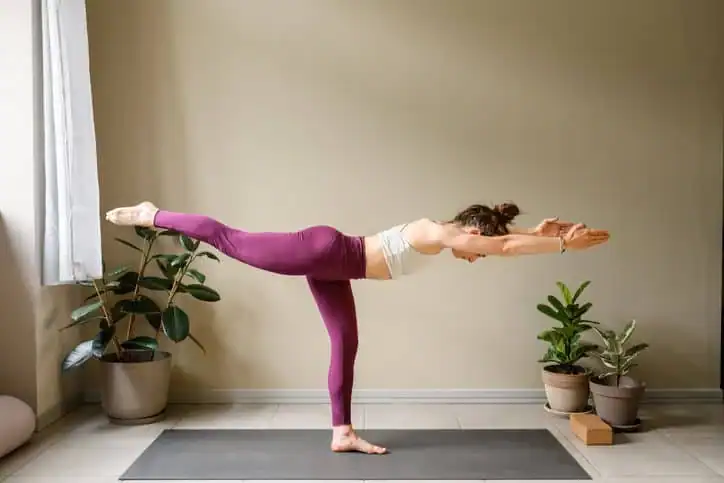 Woman doing Yoga exercise Romford to help with toning the body. 